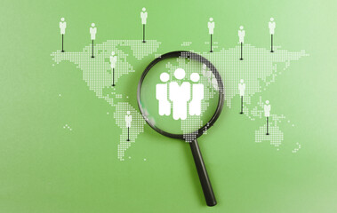 Magnifying glass focus to global customer network on world map for customer service, employment and leadership business. CRM Customer Relationship Management concept..