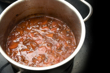 Basis for a sauce is boiled down, made from root vegetables such as carrots and celery, leek and...
