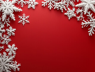 The image is a close-up of white snowflakes arranged on a red background The snowflakes are all different shapes and sizes and have a textured fuzzy appearance They are clustered