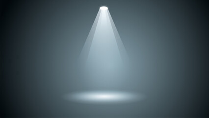 A light shining on a dark background. The light is white and the background is gray. The light is focused on a single point, creating a sense of depth and dimension