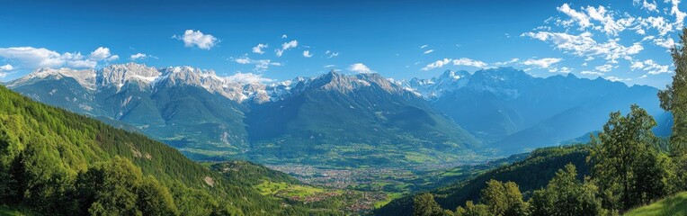 Fototapeta premium Mountainous Landscape with a Valley and a Town Below
