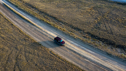 The photo shows a car from a drone top view