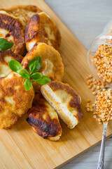 cooked fried pea pies on a wooden board