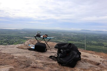 Enjoying the scenic view a perfect picnic setup on a mountain top with breathtaking landscape and tranquil atmosphere