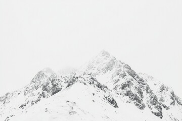 Obraz premium Snow-Covered Mountain Peaks in a Minimalist Landscape