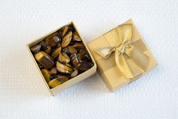 Natural mineral gem stone Tiger's eye Tigers eye, Tiger eye gemstone as nice background close up