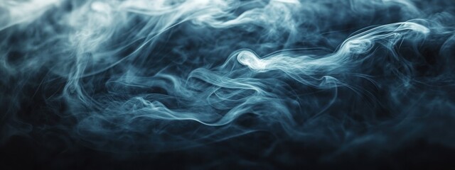 Obraz premium Abstract blue smoke wisps on black background.