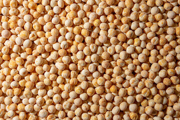 Uncooked Yellow Polished Peas Background. A Culinary Canvas of Dry Yellow Peas, Creating a Lively and Textured Background for Gourmet Cooking. Scattered Raw Polished Peas. Healthy Eating Ingredients