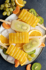 Frozen juice orange. Ice cream popsicles. Summer sweets and desserts. Vegan food. Top view