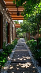 Obraz premium A stone walkway lined with lush greenery and white pebbles leading to a tranquil oasis.