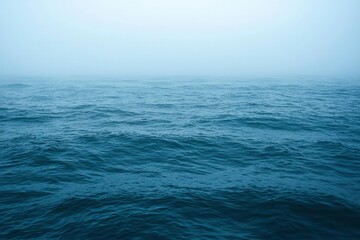 Obraz premium Foggy Ocean Surface with Gentle Waves