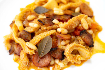 Beef tripe (bucho), beef stomach, tripe on a white plate. Dobradinha