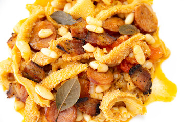 Beef tripe (bucho), beef stomach, tripe on a white plate. Dobradinha