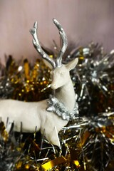 christmas arctic reindeer decor ornament in gold metalic background and glitters