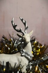 christmas arctic reindeer decor ornament in gold metalic background and glitters