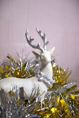 christmas arctic reindeer decor ornament in gold metalic background and glitters