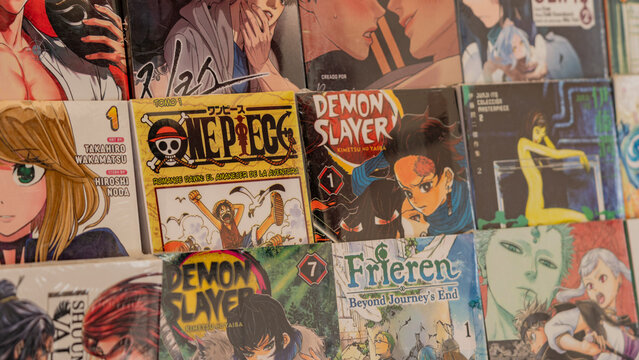 Budokan Geek Convention In GUAYAQUIL, ECUADOR - 
OCT 13, 2024 - Close-up of various popular manga titles, including One Piece and Demon Slayer, displayed in a bookstore. Perfect for manga enthusiasts