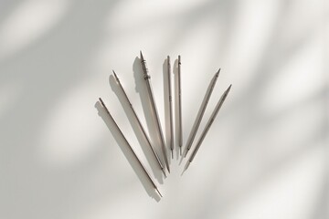 A sewing needle kit displayed on a clean design background with shadows
