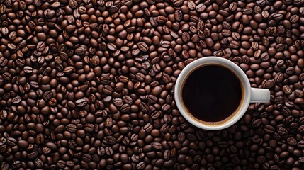 Fototapeta premium Coffee Cup with Roasted Coffee Beans Background Top View
