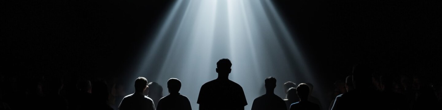 A group of people are standing in a dark room with a spotlight shining on them. Scene is mysterious and dramatic