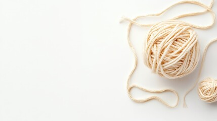 A macro shot of wool yarn knitted into a complex pattern, with fibers clearly defined on a white backdrop.