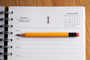 2025 diary on page of January with yellow pencil