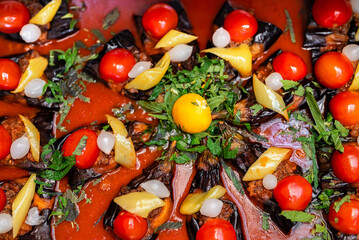 Baked eggplants with tomatoes in tomato sauce.