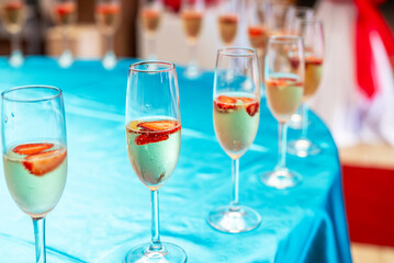 Glasses of chilled champagne at the entrance to the event.