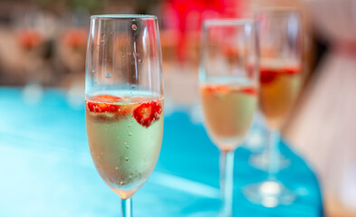 Glasses of chilled champagne at the entrance to the event.