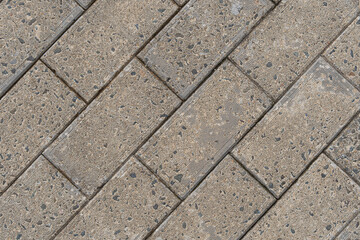 Tiled pavement of the street. Diagonal composition.