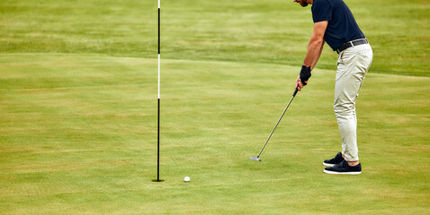 Fototapeta premium A Golfer Engages in Taking a Precise Shot from the Rough Grass on a Beautiful Sunny Day