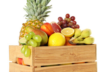 Many different fresh fruits in wooden crate isolated on white