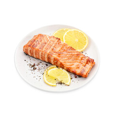 Delicious grilled salmon fillet with lemon slices and spices isolated on white