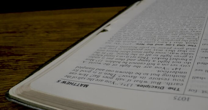 Holy Bible Macro Man Hand Turning Pages Gospel According To Matthew