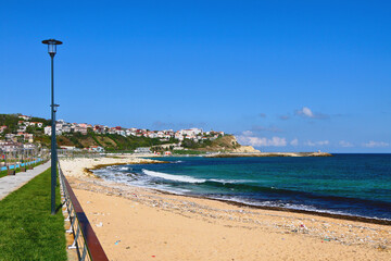 Embankment and the city on the seashore. Karaburun, Istanbul, Turkey