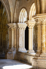 historic interior hallway in cloister church portugal. Empty hall, pillar with carved decorations and arched row. Elegant interior architecture. Religious buildings. 