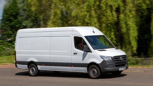 2023 white Mercedes van driving on a British country road