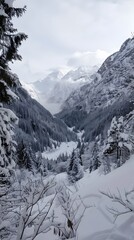 Panoramic view down snow covered valley in alpine mountain range