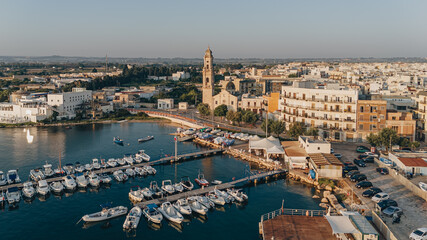 Mola di Bari, Italy - 23 August 2024: Areal view of the beautiful harbor with fishing boats
