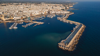 Mola di Bari, Italy - 23 August 2024: Areal view of the beautiful harbor with fishing boats