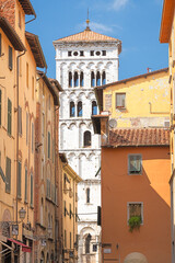 San Michele church and small alley in the old town of Lucca, Tuscany, Italy