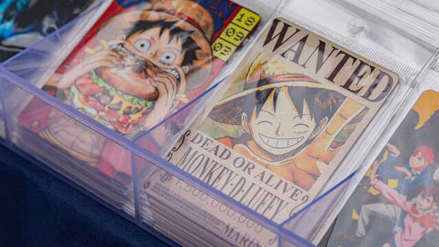 Budokan Geek Convention In GUAYAQUIL, ECUADOR - Close-up of One Piece merchandise featuring Monkey D. Luffy, including his iconic wanted poster, on display at a convention.