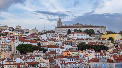 Fototapeta premium Panoramic Exposure done from a Cruise ship in the Cruise Ship terminal in Lisbon, of the Alfama neighborhood upon departure on the tagus river, Portugal