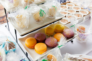 Colorful Display Of Macarons And Desserts Wrapped Neatly