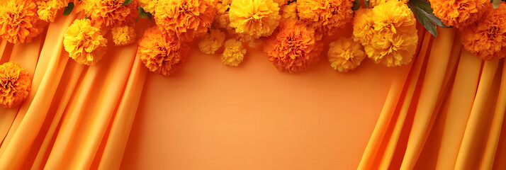 Orange Marigold flower garland decor on fabric background for festive celebrations, Indian wedding, Diwali, Puja, Ethnic decoration, floral design, orange theme