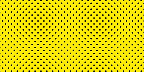 black polka dots pattern on bright yellow background	

