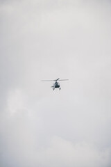 A helicopter is flying in the sky
