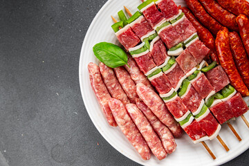 sausage meat assorted juicy pork, beef fresh delicious gourmet food background on the table rustick food top view copy space