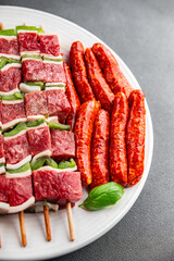 sausage meat assorted juicy pork, beef fresh delicious gourmet food background on the table rustick food top view copy space