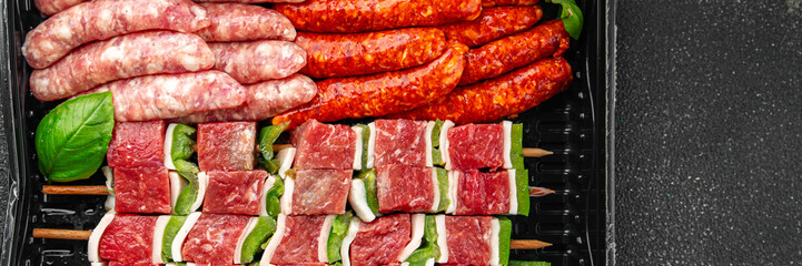 sausage meat assorted juicy pork, beef fresh delicious gourmet food background on the table rustick food top view copy space